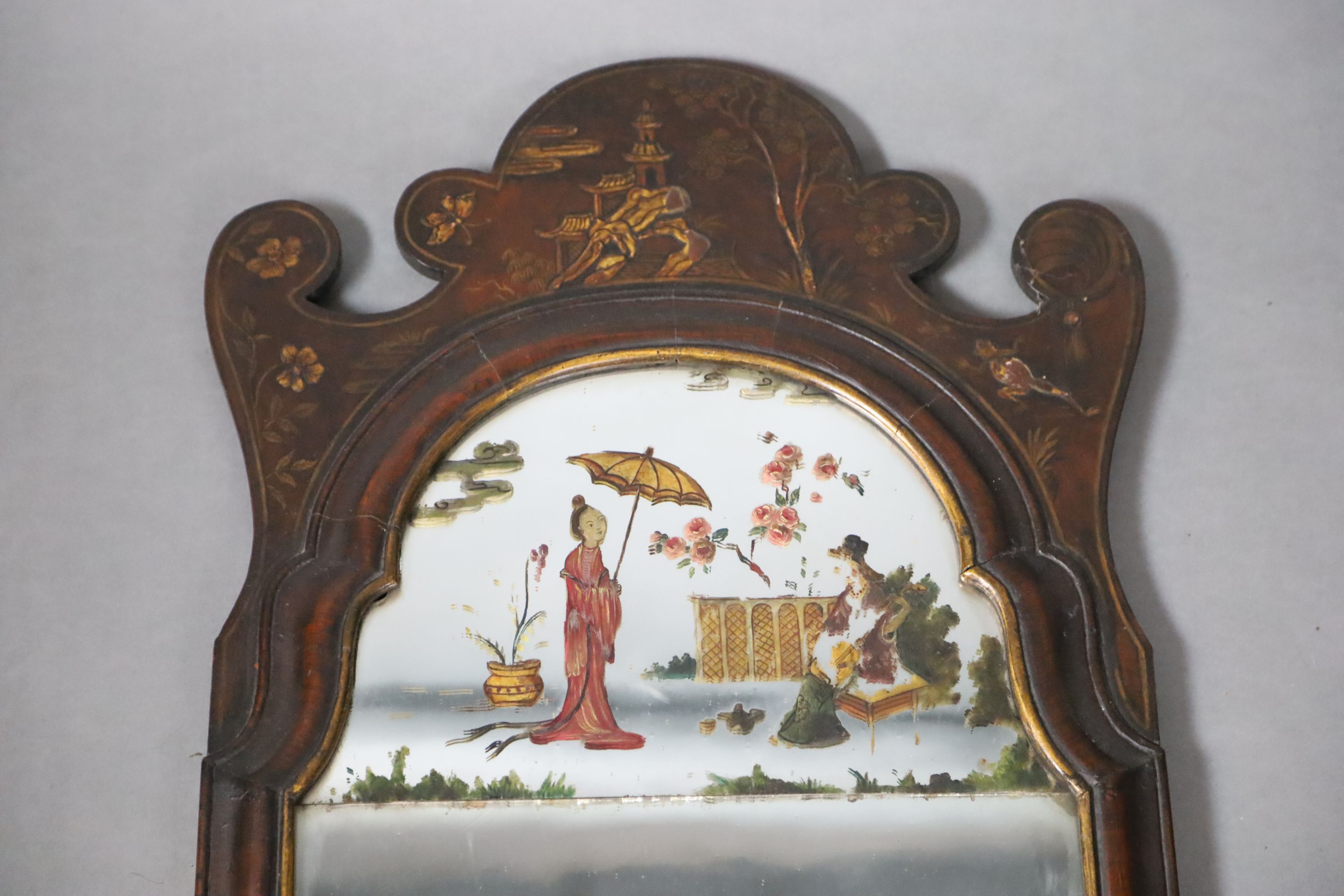 An early 18th century style chinoiserie lacquered walnut wall mirror, W.38cm H.119.5cm